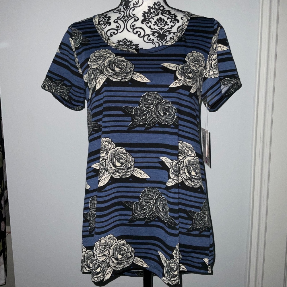 Blue and black stripped shirt with tan rose print.